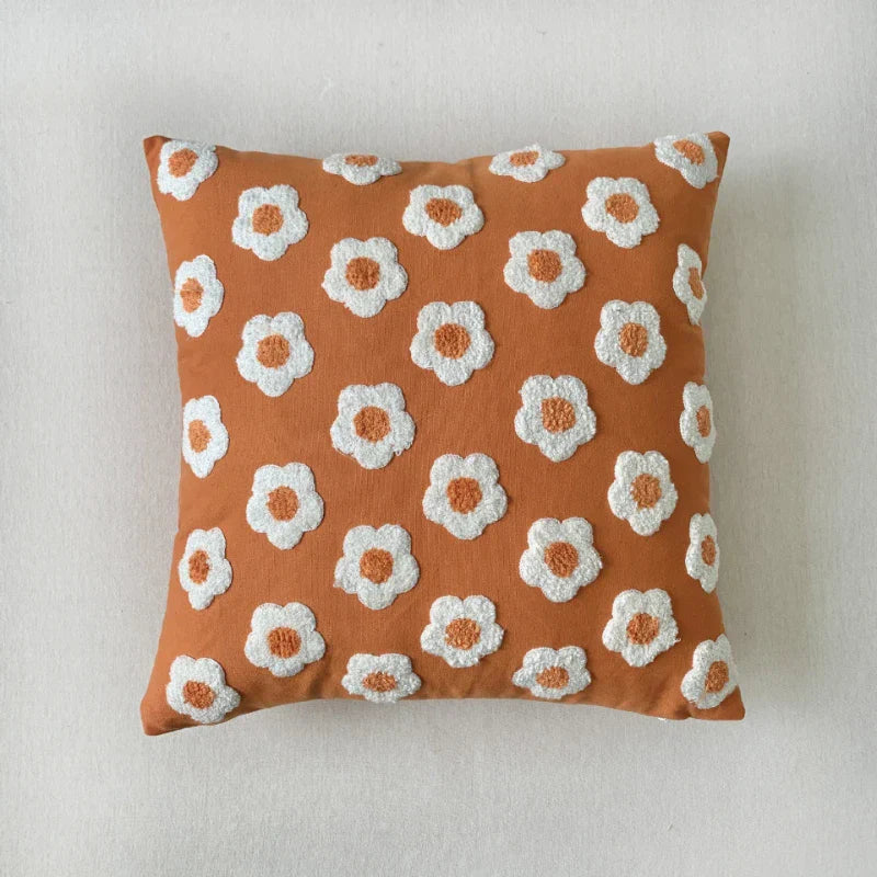 vierkante kussenhoes met jacquard patroon en borduursel in close-up