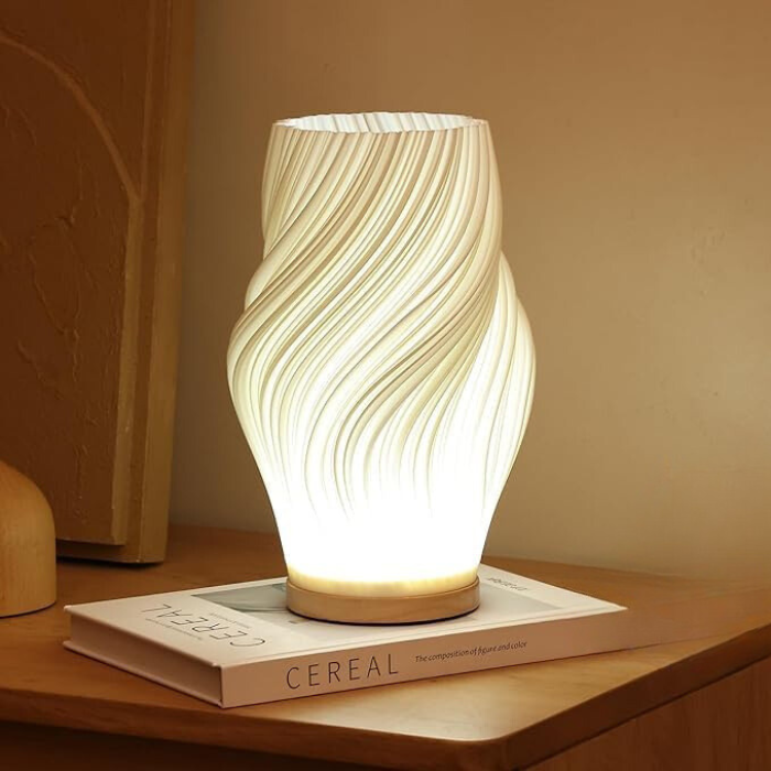 stijlvolle led tafellamp met gebogen silhouet en zachte lichtuitstraling